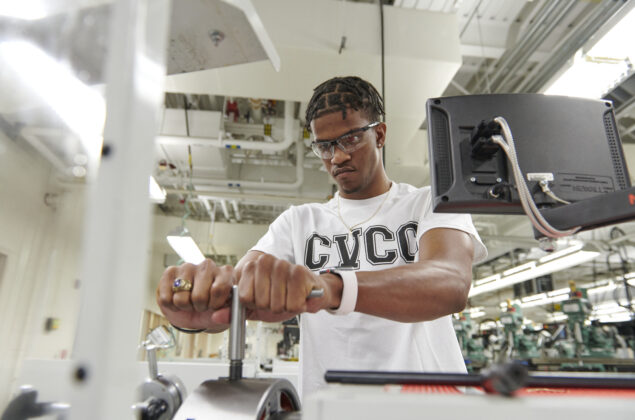 A college student works in a laboratory.