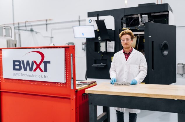 A BWXT employee works in a manufacturing facility
