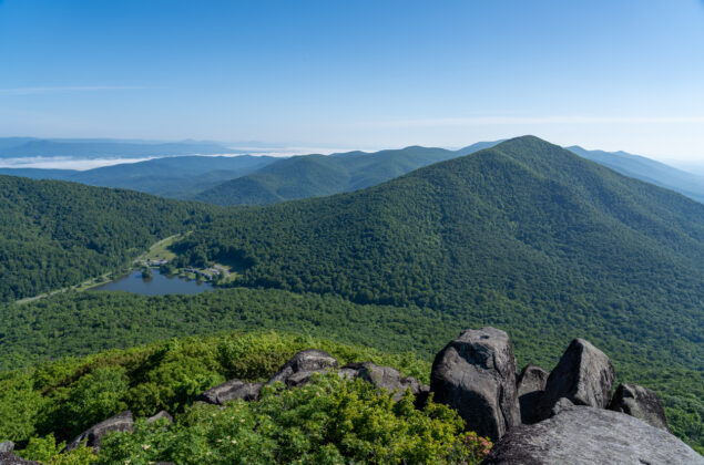 View from sharp top mountain out to peaks of otter lodge and the blue ridge.
